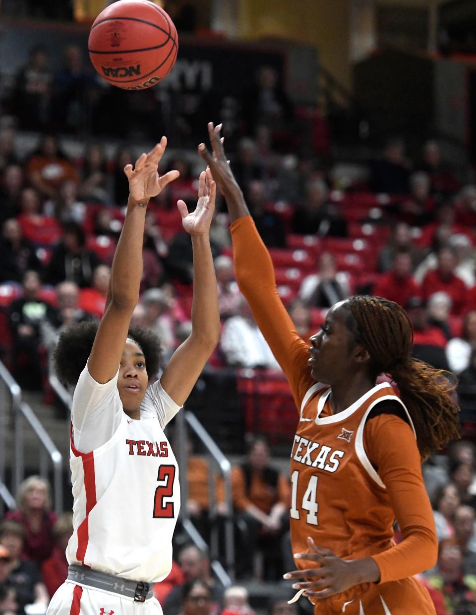 Texas Tech's guard Kilah Freelon (2), left, shoots the ball against Texas in a Big 12 women's basketball game, Wednesday, Jan. 18, 2023, at United Supermarkets Arena.