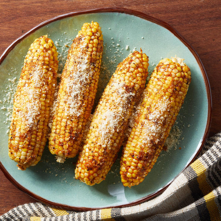 <p>Savory Parmesan cheese and sweet corn team up in this easy corn on the cob recipe that's good for every season. Wrapping the corn in foil keeps in the flavors of smoked paprika, garlic powder and thyme. Pair with roast chicken, steak or pork or serve as part of a vegetarian meal. <a href="https://www.eatingwell.com/recipe/7873409/parmesan-roasted-corn-on-the-cob/" rel="nofollow noopener" target="_blank" data-ylk="slk:View Recipe" class="link ">View Recipe</a></p>