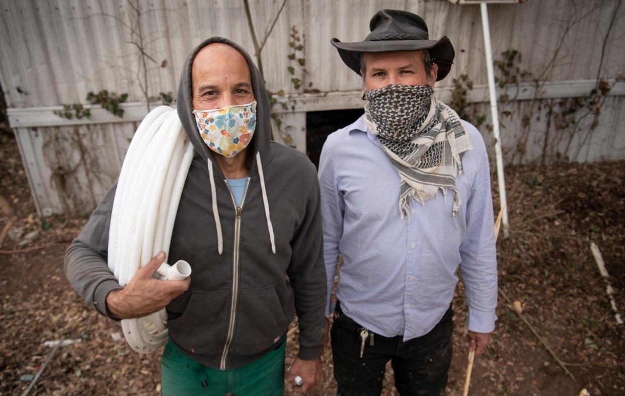 Michael Kunitzky and Colby Adams of the Austin Guerrilla Plumber Corps pose for a portrait Thursday, Feb. 25, 2021 in Austin, Texas. The corps of five friends, is working to repair underprivileged residents’ plumbing problems caused by the winter storm. 