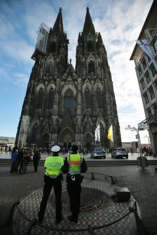 German police stand guard outside's Cologne's landmark cathedral, where several offenses against women were committed on New Year's Eve