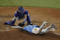 Tampa Bay Rays' Manuel Margot is tagged out at home by Los Angeles Dodgers catcher Austin Barnes trying to steal during the fourth inning in Game 5 of the baseball World Series Sunday, Oct. 25, 2020, in Arlington, Texas. (AP Photo/Sue Ogrocki)