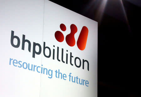 FILE PHOTO: A promotional sign adorns a stage at a BHP Billiton function in central Sydney August 20, 2013. REUTERS/David Gray/File Photo