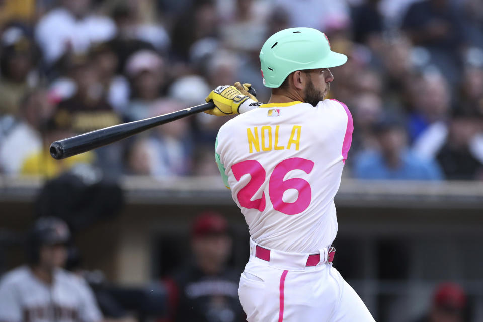 San Diego Padres' Austin Nola watches his RBI double against the Arizona Diamondbacks during the second inning of a baseball game Friday, July 15, 2022, in San Diego. (AP Photo/Derrick Tuskan)