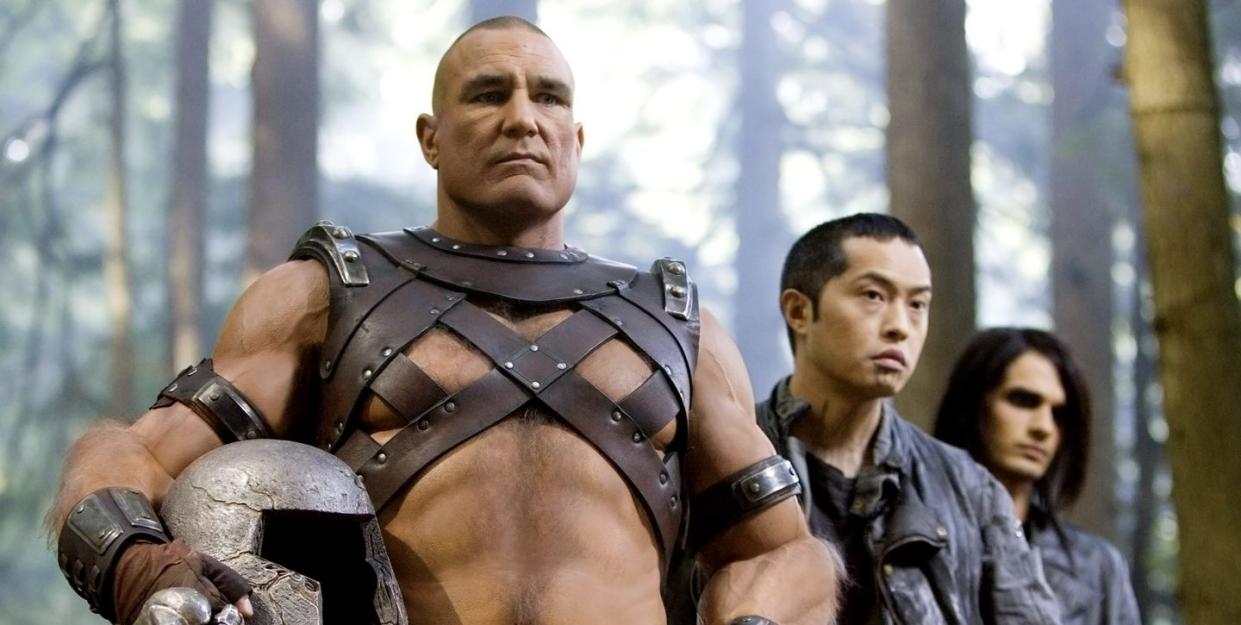 vinnie jones as juggernaut, xmenthe last stand, a man stands in warrior costume holding a helmet