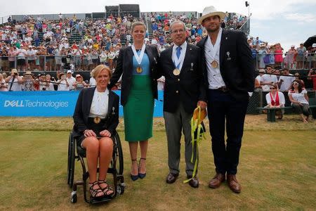 The 2017 inductees into the International Tennis Hall of Fame (L-R) Monique Kalkman van den Bosch of the Netherlands, Kim Clijsters of Belgium, journalist Steve Flink of the U.S. and Andy Roddick of the U.S pose for photographs after ceremonies in Newport, Rhode Island, U.S., July 22, 2017. REUTERS/Brian Snyder