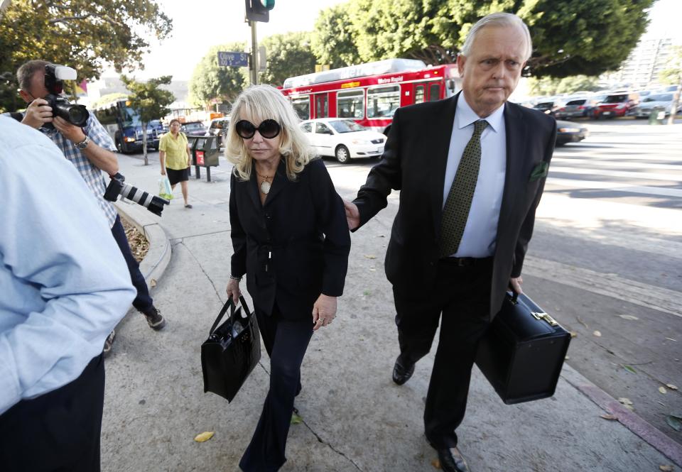 Shelly Sterling, 79, (L) arrives at court with her lawyer Pierce O'Donnell in Los Angeles, California July 7, 2014. The $2 billion sale of the NBA's Los Angeles Clippers faces a key legal hurdle on Monday as the estranged husband and wife who own the franchise battle in court over control of the team. Shelly Sterling, 79, has asked a Los Angeles judge to confirm her as having sole authority to sell the pro basketball franchise to former Microsoft Corp chief executive Steve Ballmer at an NBA-record price after husband Donald Sterling vowed to block the deal. REUTERS/Lucy Nicholson (UNITED STATES - Tags: CRIME LAW SPORT BASKETBALL BUSINESS)