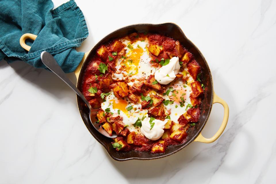 This skillet dinner brings together two tapas favorites: patatas bravas and huevos rotos. <a href="https://www.epicurious.com/recipes/food/views/smoky-spanish-potatoes-and-eggs?mbid=synd_yahoo_rss" rel="nofollow noopener" target="_blank" data-ylk="slk:See recipe.;elm:context_link;itc:0" class="link ">See recipe.</a>