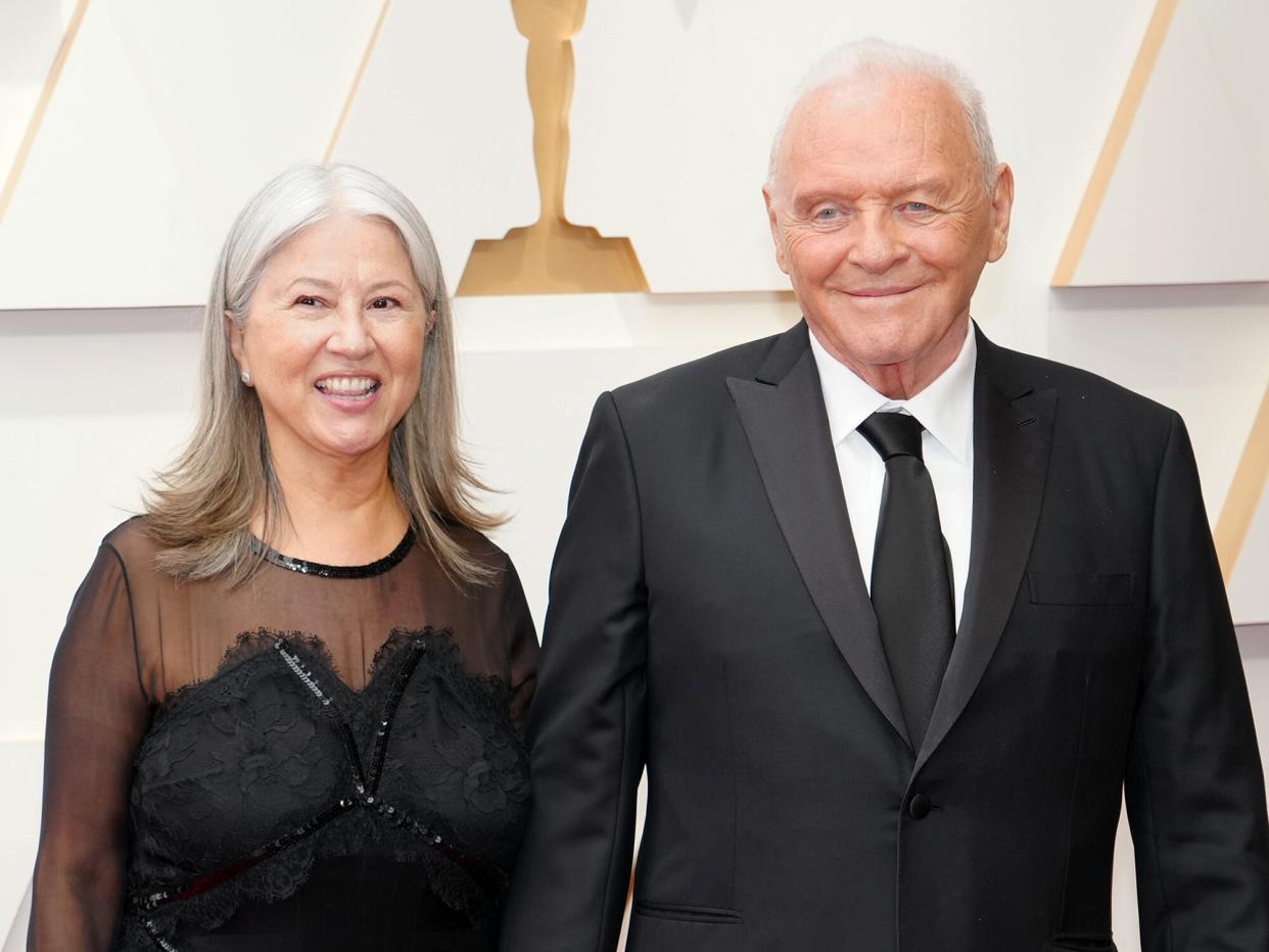 Stella Arroyave and Anthony Hopkins attend the 94th Annual Academy Awards at Hollywood and Highland on March 27, 2022 in Hollywood, California