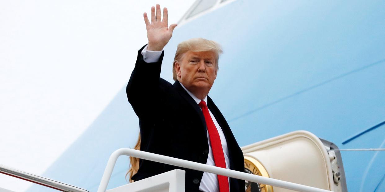 U.S. President Donald Trump waves as he boards Air Force One with First Lady Melania Trump at Joint Base Andrews in Maryland en route to West Palm Beach, Florida, U.S., January 31, 2020. REUTERS/Yuri Gripas