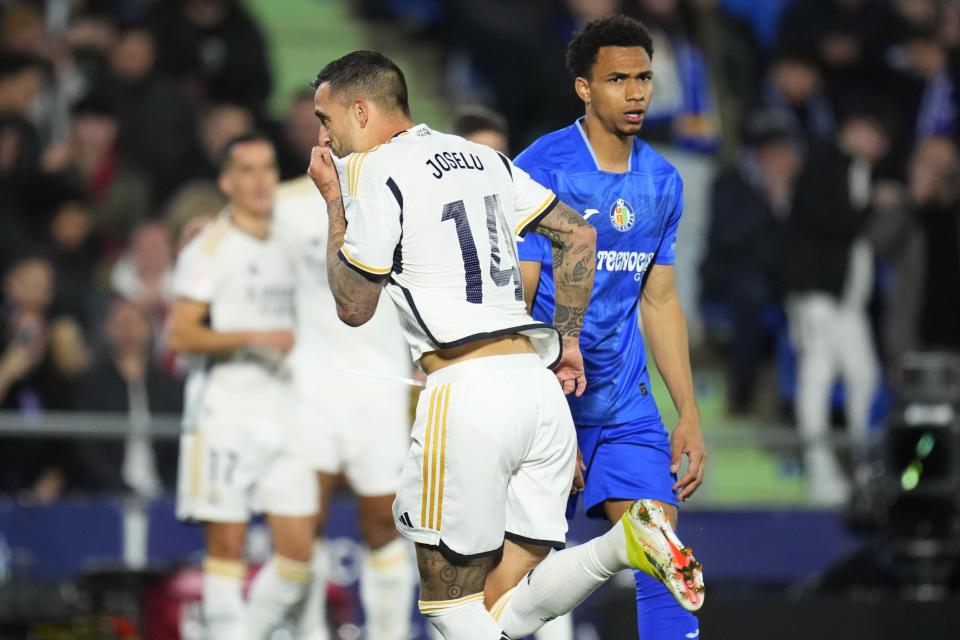 Real Madrid's Joselu celebrates after scoring his sides first goal during the Spanish La Liga soccer match between Getafe durante el partido contra Getafe en la Liga española, el jueves 1 de febrero de 2024, en Getafe. (AP Foto/Manu Fernández) and Real Madrid at the Coliseum Alfonso Perez stadium in Getafe, Spain, Thursday, Feb. 1, 2024. (AP Photo/Manu Fernandez)