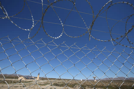 The installations of a Chinese space station are seen behind a fence in Las Lajas, Argentina, January 22, 2019. REUTERS/Agustin Marcarian