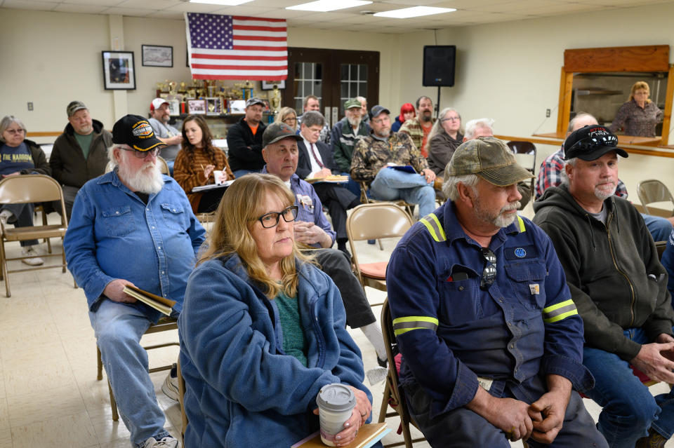 Tammy Yoders with her husband, Bill, and Tim Brady during a town  meeting led by the Center for Coalfield Justice in New Freeport, Pa., on March 29, 2023. (Justin Merriman for NBC News)