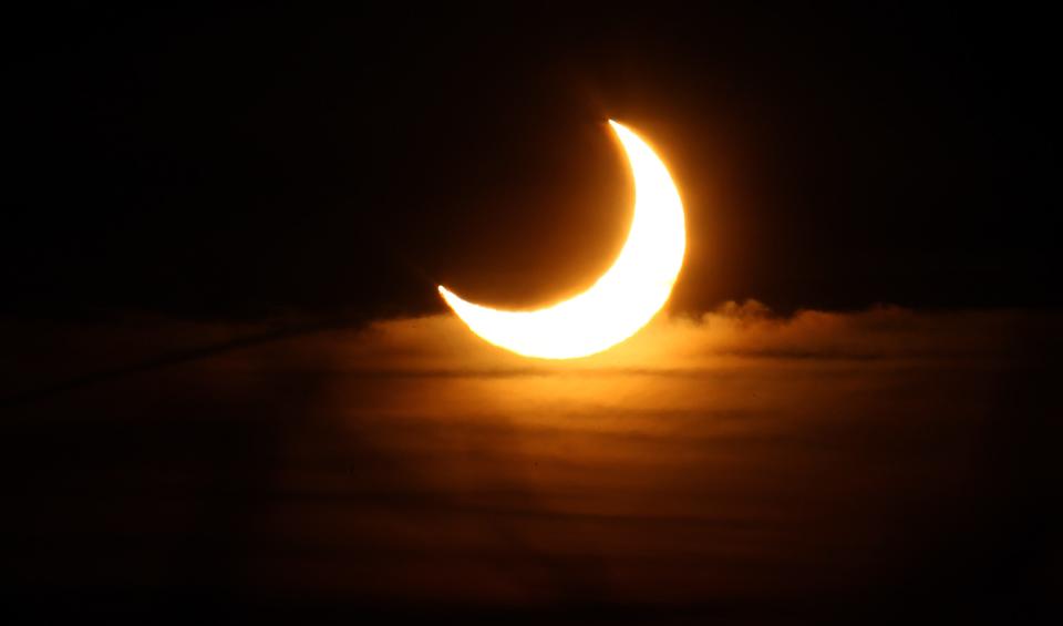 The sun is seen covered by the moon during a partial solar eclipse on January 4, 2011 in Dinslaken, Germany.
