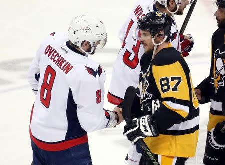 May 10, 2016; Pittsburgh, PA, USA; Washington Capitals left wing Alex Ovechkin (8) and Pittsburgh Penguins center Sidney Crosby (87) shake hands after game six of the second round of the 2016 Stanley Cup Playoffs at the CONSOL Energy Center. The Pens won 4-3 in overtime to win the series 4 games to 2. Mandatory Credit: Charles LeClaire-USA TODAY Sports