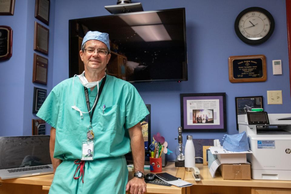 Arizona Burn Center Director Dr. Kevin Foster stands in his office at Valleywise Health medical center in Phoenix on July 25, 2022.