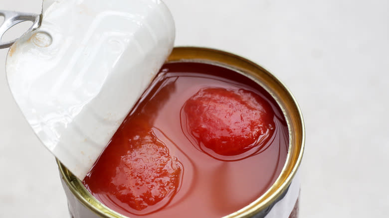 open can of whole tomatoes