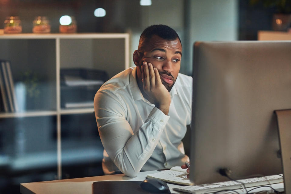 Man working late at office. (Getty Images)