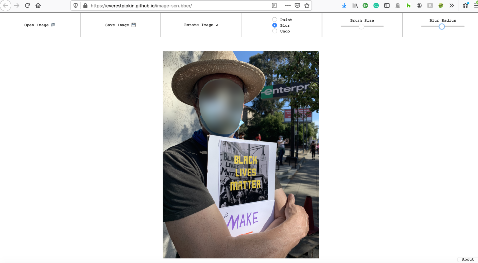 Jennifer's husband at a peaceful protest in Oakland, California this week. This is the "after" shot, using Image Scrubber to blur his face.