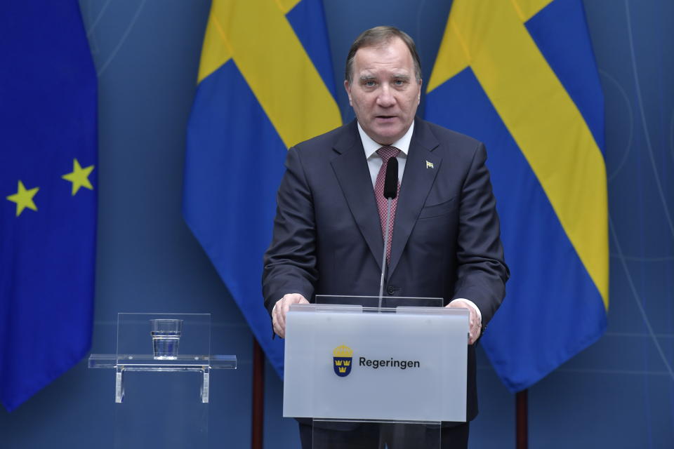 Sweden's Prime Minister Stefan Lofven speaks during a coronavirus news conference, in Stockholm, Friday, Dec. 18,2020. The Swedish government is tightening nationwide coronavirus restrictions by lowering the number of people who can gather in a restaurant and making face masks mandatory on public transportation. Sweden has stood out among European nations for its comparatively hands-off response to the pandemic. (Jessica Gow/TT News Agency via AP)