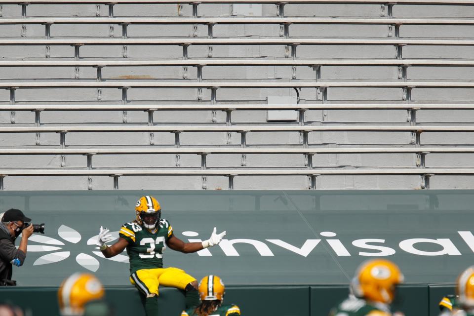 Green Bay Packers' Aaron Jones celebrates his touchdown catch during the first half of an NFL football game against the Detroit Lions Sunday, Sept. 20, 2020, in Green Bay, Wis. (AP Photo/Matt Ludtke)