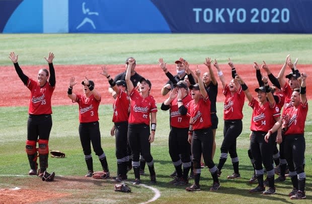 Canada's women's softball team cheers after winning the bronze medal in their game against Mexico at the Tokyo Olympic Games.  (Koji Watanabe/Getty Images - image credit)