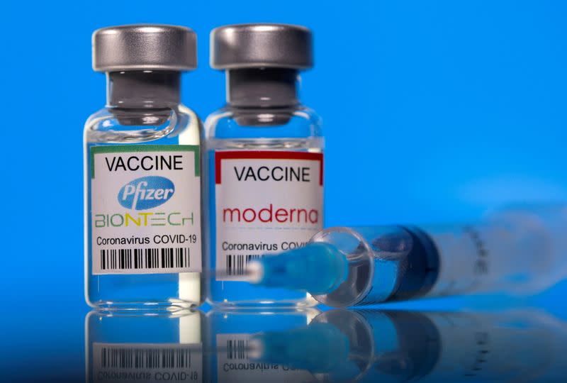 FILE PHOTO: FILE PHOTO: Picture illustration of vials with Pfizer-BioNTech and Moderna coronavirus disease (COVID-19) vaccine labels