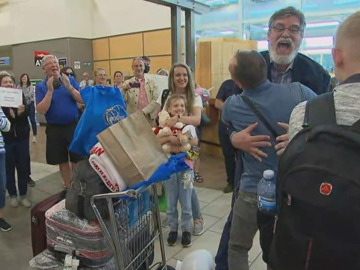 This month, 170 Ukrainians met their host families and reunited with relatives, thanks to a new immigration program that's quite different from a refugee program. (CBC - image credit)