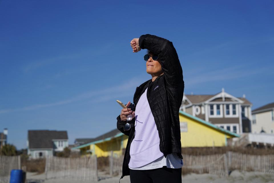 A spectator watches after a suspected Chinese spy balloon was shot down off the coast in Holden Beach, North Carolina, U.S. February 4, 2023 (REUTERS)