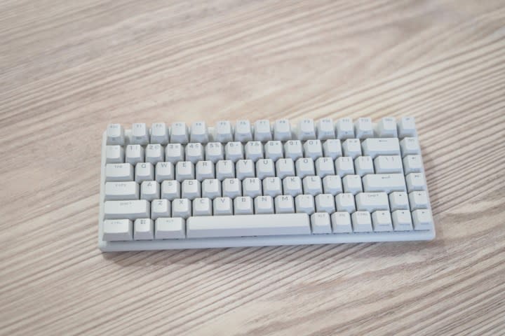 The Alienware Pro Wireless Keyboard on a wooden table.