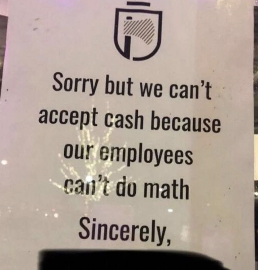 Sign apologizing for not accepting cash due to employees' math skills, with humor