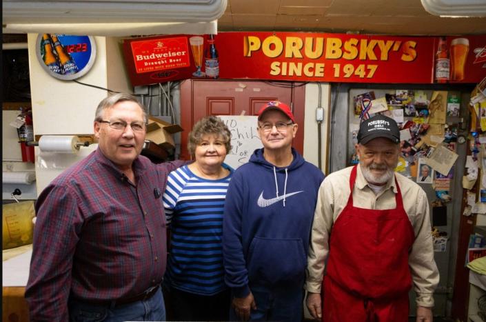 Bill Pierson, from left, his wife, Cecelia Pierson and her siblings Matthew Porubsky and Charlie Porubsky were all involved with Porubsky&#39;s, an iconic North Topeka deli known for its chili and hot pickles. The eatery closed April 30.