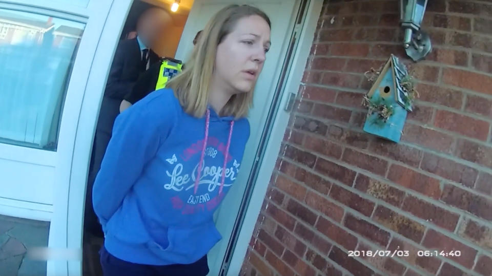 CHESTER, ENGLAND - JULY 3: In this frame from a police body-camera video provided by Cheshire Constabulary, Lucy Letby is arrested on July 3, 2018 in Chester, England.  Letby, a former nurse at Countess of Cheshire Hospital, was convicted on August 18, 2023 of murdering seven babies, and attempting to murder six more, in the hospital's neonatal ward between 2015 and 2016. She was found not guilty of two counts of attempted murder, while the jury did not reach verdicts on six further counts of attempted murder. (Handout photo by Cheshire Constabulary via Getty Images)