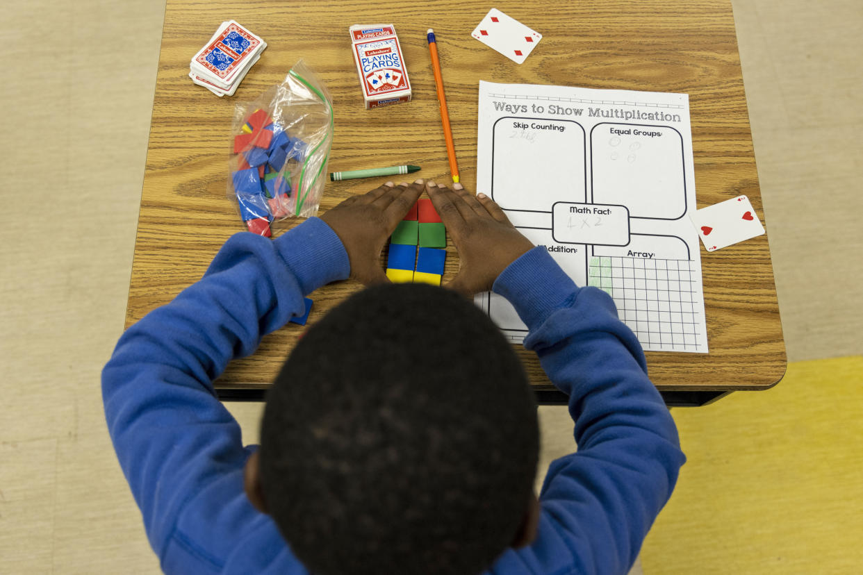 A student uses tiles while working on a multiplication problem at Ida Green Elementary. (Brad Vest / for NBC News)