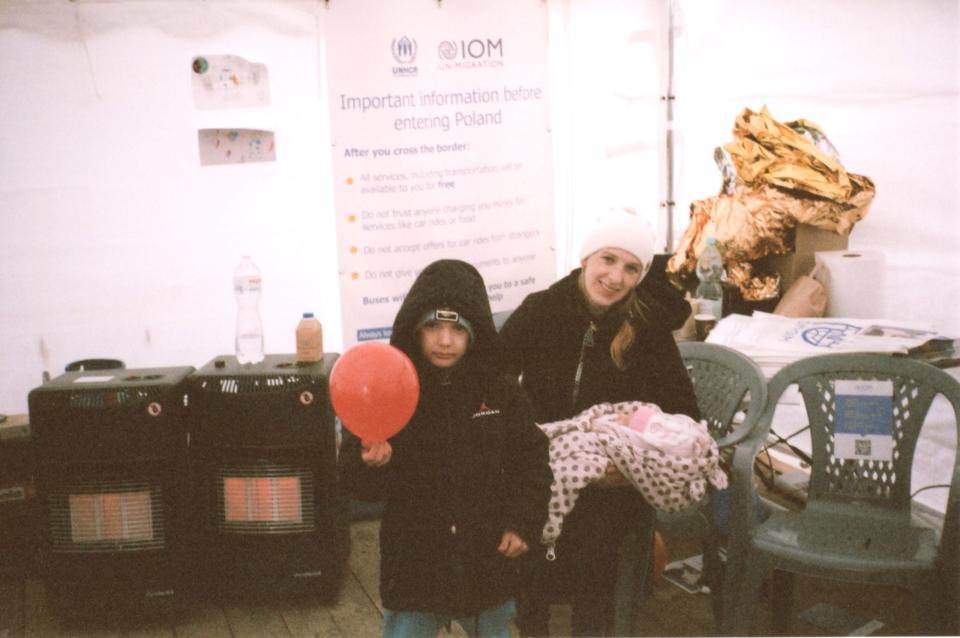 A mother and her children take temporary refuge at the International Organization for Migration. Credit: Harper Simon