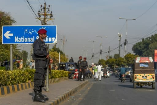 A policeman stands guard outside the National Stadium during a practice session for Pakistan Super League in Karachi