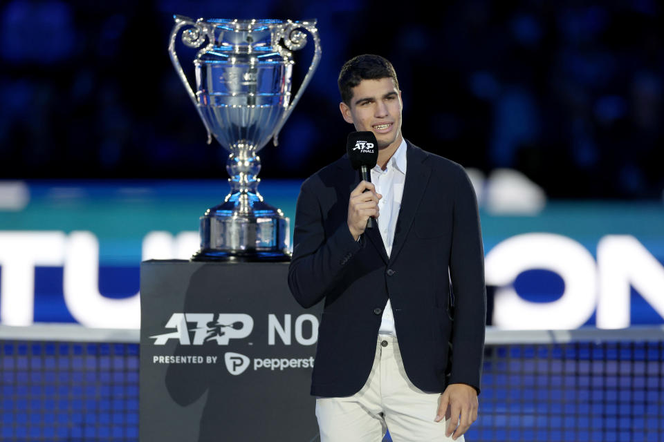 Carlos Alcaraz (pictured) speaks to the audience at the ATP Year End Number One Trophy ceremony.