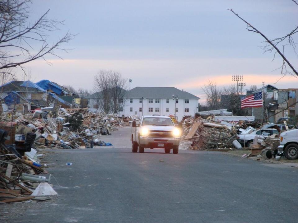 In the days following the Nov. 17, 2013 tornado, debris is piled along Gillman Street in Washington near the home of Randey Wall, one of the few residents able to live in their home after the storm.