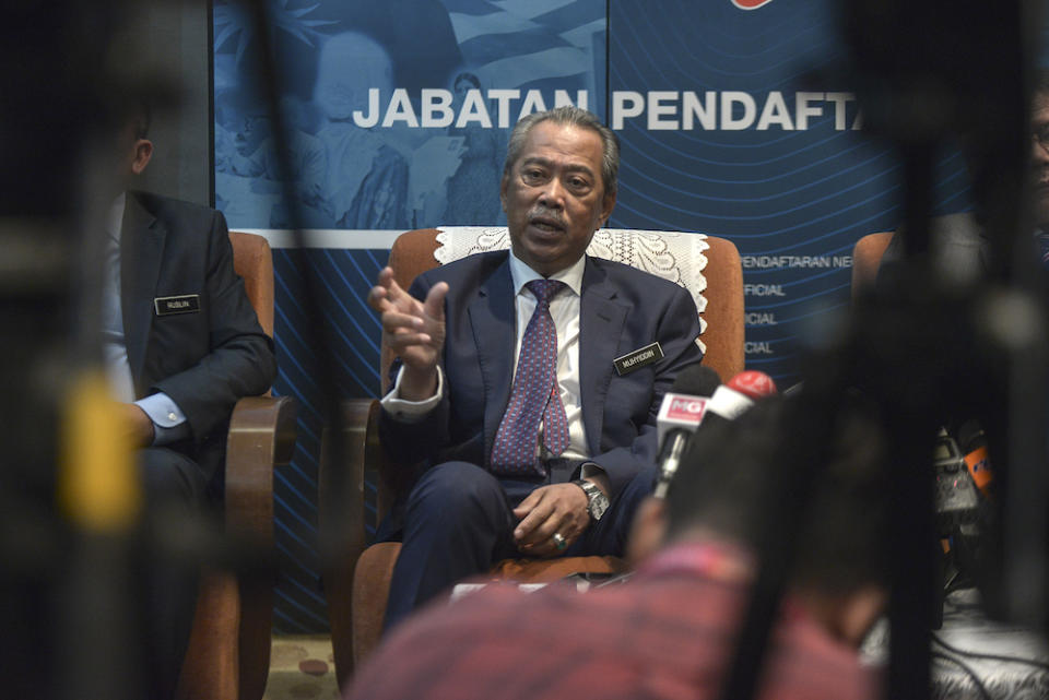 Home Minister Tan Sri Muhyiddin Yassin speaks to the media after officiating National Registration Day at the National Registration Department in Putrajaya October 16, 2019. — Picture by Shafwan Zaidon