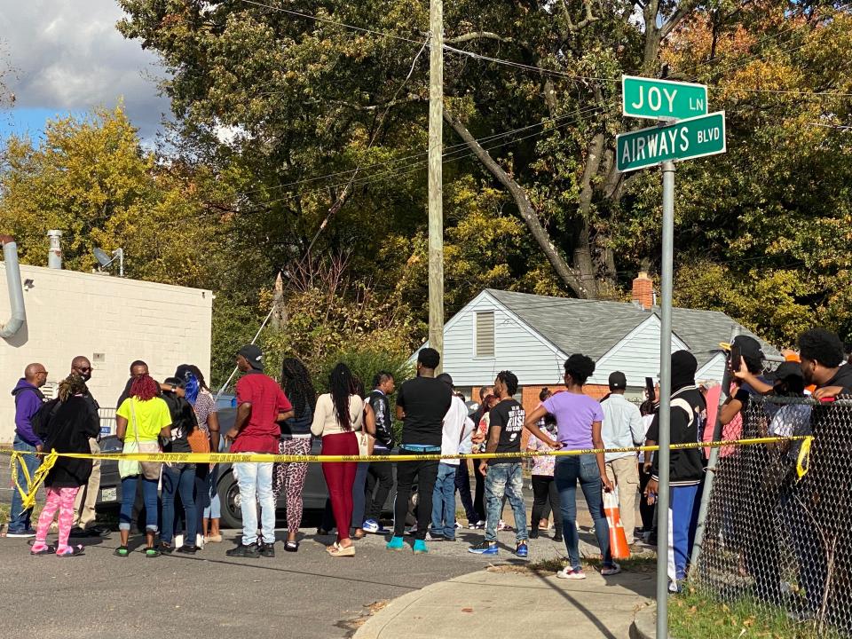 Crowds gather at the intersection of Joy Lane and Airways Boulevard in South Memphis near the scene of a fatal shooting that reportedly killed Memphis rapper Young Dolph on Wednesday afternoon, Nov. 17, 2021, in Memphis, Tenn.