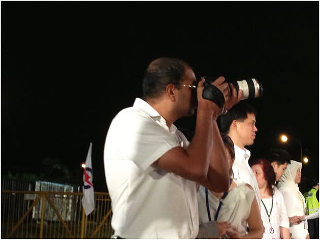 Pasir Ris-Punggol GRC MP Dr Janil Puthucheary snapping some shots at the PAP's final by-election rally