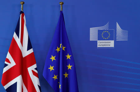 A British and a European flag are pictured ahead of the European Union leaders summit in Brussels, Belgium October 17, 2018. REUTERS/Yves Herman