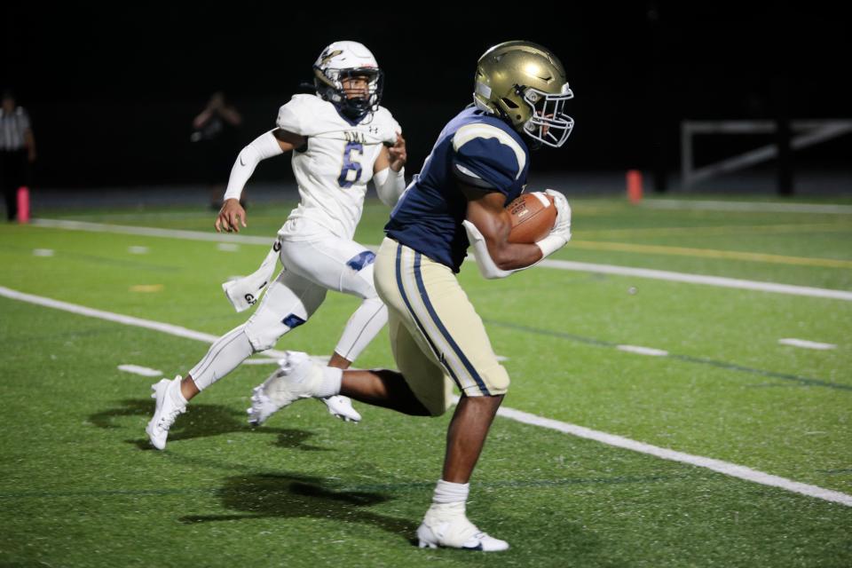 Salesianum's B.J. Alleyne (right) runs for a touchdown in a 44-21 victory over Delaware Military Academy on Thursday night at Abessinio Stadium.