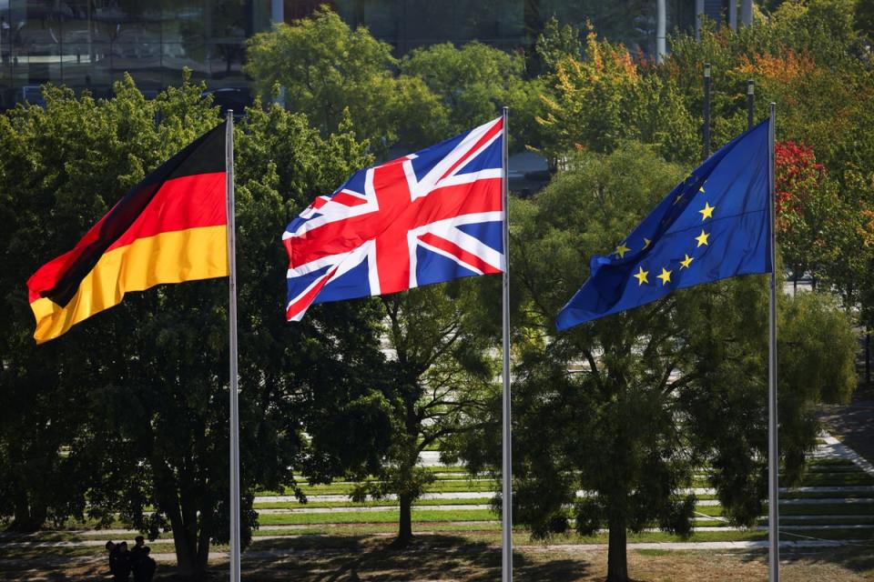 Flags of Britain, Germany and the EU fly ahead of the arrival of Olaf Scholz and Keir Starmer in Berlin (REUTERS)