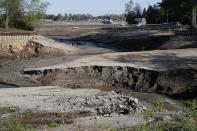 View of Wixom Lake, Thursday, May 21, 2020, after the water was drained after the Edenville Dam failed and flood waters rushed south, ravaging the landscape in its path, in Edenville Township, Mich. (AP Photo/Carlos Osorio)