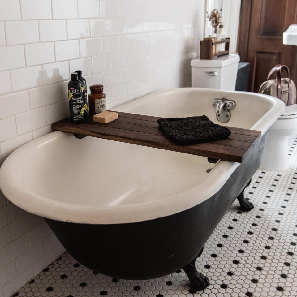 Find this wooden bath caddy for $190 on <a href="https://fave.co/3cpdPll" target="_blank" rel="noopener noreferrer">Etsy</a>.