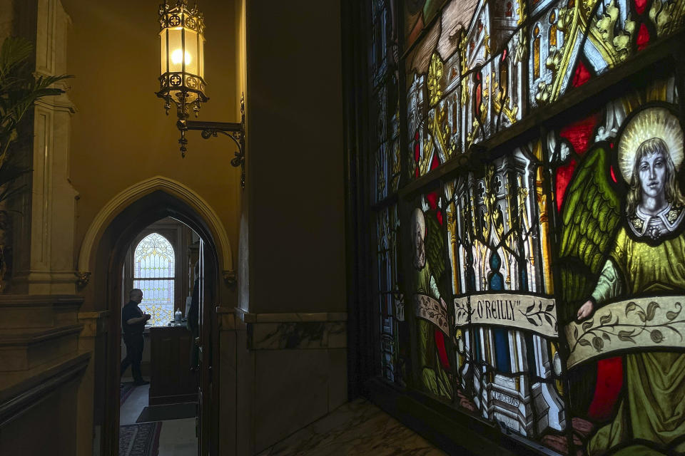 The Rev. Juan Eduardo Rodriguez, who later became pastor of St. Margaret Catholic Church, walks through St. Peter the Apostle Catholic Church in Reading, Pa., Wednesday, June 12, 2024. (AP Photo/Luis Andres Henao)