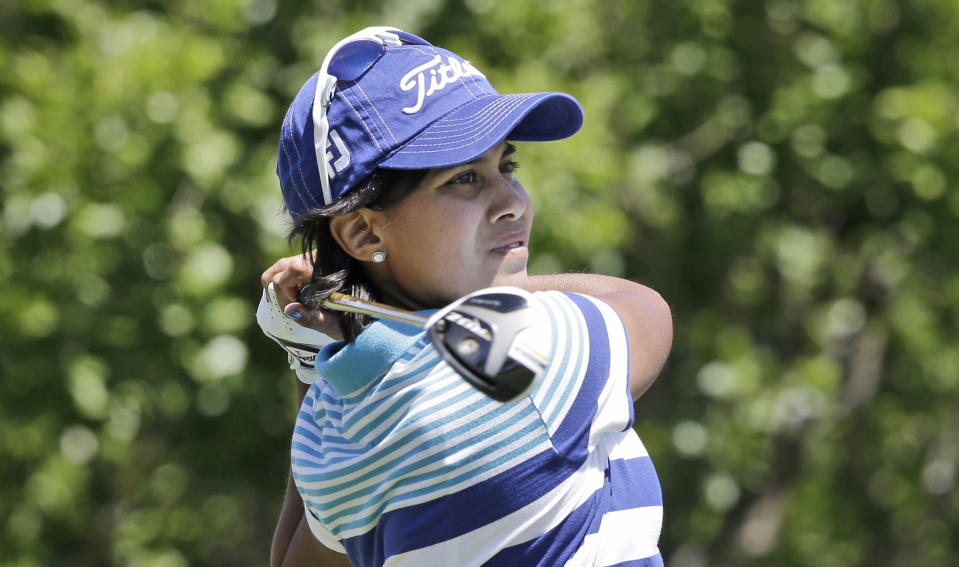 Julieta Granada, of Paraguay, watches here tee shot on the second hole during the third round of the North Texas LPGA Shootout golf tournament at the Las Colinas Country Club in Irving, Texas, Saturday, May 3, 2014. (AP Photo/LM Otero)