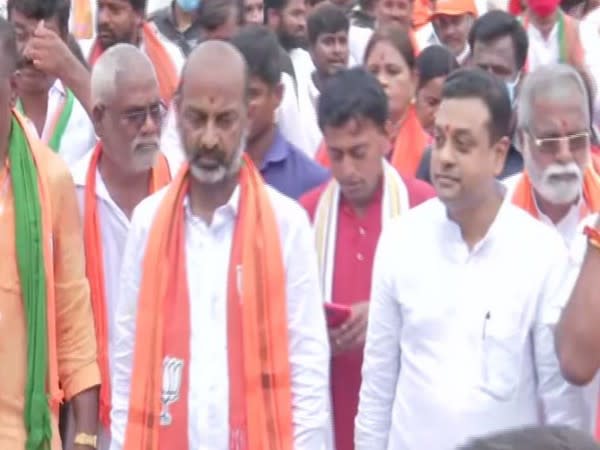 BJP's  Sambit Patra and Bandi Sanjay during Praja Sangrama Yatra. (Photo/ ANI)