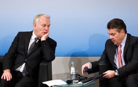 France's Foreign Minister Jean-Marc Ayrault speaks to Germany's Foreign Minister Sigmar Gabriel during the 53rd Munich Security Conference in Munich, Germany, February 18, 2017. REUTERS/Michaela Rehle