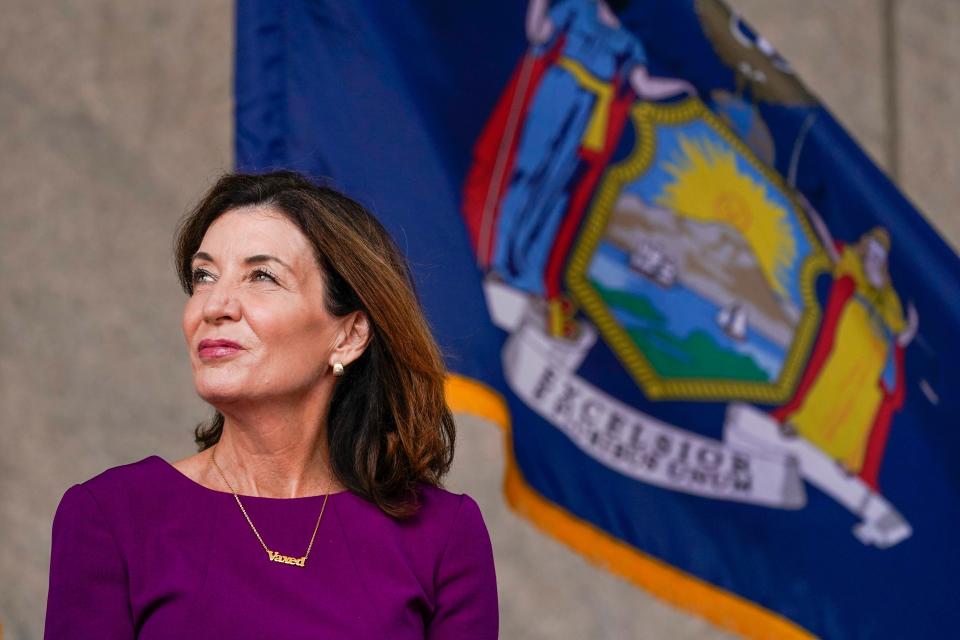 New York Gov. Kathy Hochul wears a necklace with the word "vaxed" during an event in the Harlem neighborhood of New York, Thursday, Aug. 26, 2021. Hochul has selected Brian Benjamin, a state senator from New York City, as her choice for lieutenant governor. (AP Photo/Mary Altaffer)